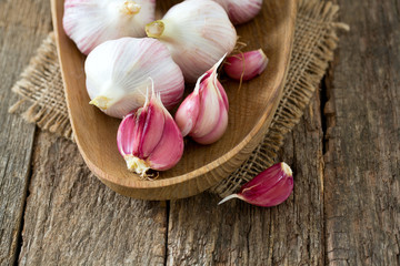 fresh garlic on wooden surface