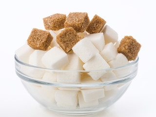 Lumps of brown sugar in glass bowl