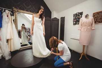 Woman trying on wedding dress