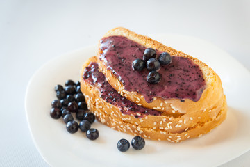 Sandwiches with cream honey and blueberries