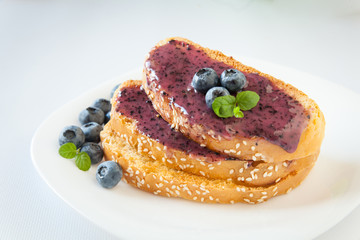 Sandwiches with cream honey and blueberries