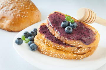 Sandwiches with cream honey and blueberries