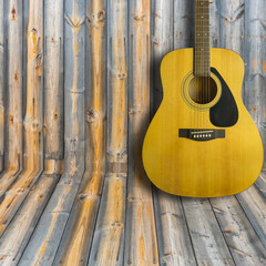 Obraz premium Acoustic guitar on wooden background texture.Copy space