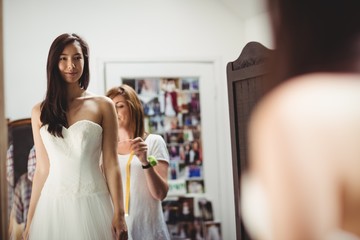 Woman trying on wedding dress