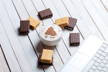 cup of coffee, cookies and laptop