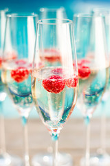champagne glasses wich raspberries

