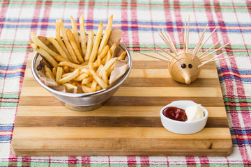 Fried potatoes with ketchup and mayonnaise