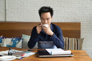 asian men relax with coffee in cafe city