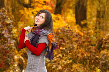 Fototapeta na wymiar Autumn woman portrait outdoors at the park