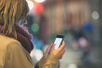 Using cellphone with de-focused city lights.