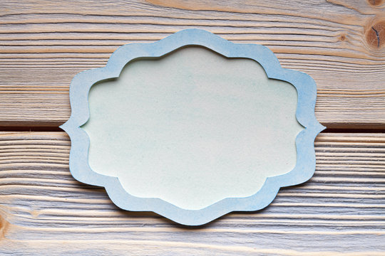 Paper label on wooden background