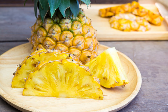 Pineapple and fork - Summer time vacation holiday healthy concept .