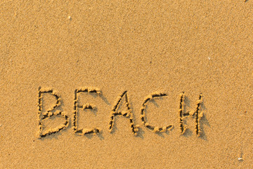Beach - word drawn on the sand.