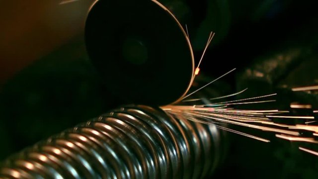 Sawing metal corrugated pipe with a jigsaw. Super slow motion video, 500 fps