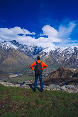 Fototapeta premium Man on top of mountain. Conceptual scene.
