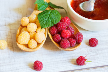 Fresh raspberries on the wooden table. Beautiful background.