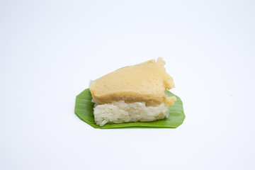 sticky rice with egg custard on green banana leaf. Thai dessert.
