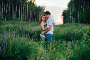 Lovers laughing in the summer park