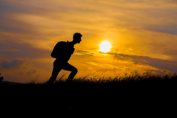 Follow your dreams, silhouette of man at sunset