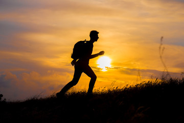 Follow your dreams, silhouette of man at sunset