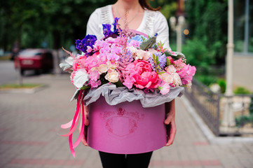 Beautiful tender bouquet of flowers in pink box