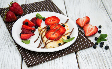 crepes with strawberries and chocolate sauce