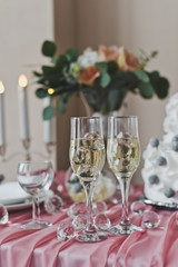 The champagne glasses are on a pink, decorated the table 6448.