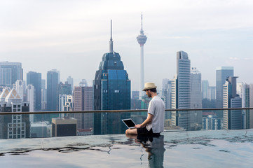 Fototapeta premium Businessman in an infinity pool