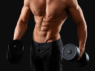 Fototapeta na wymiar Male bodybuilder posing in studio