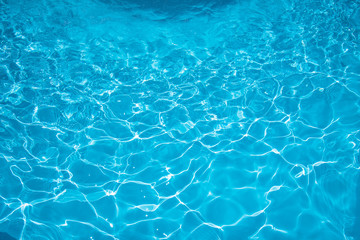 Fototapeta na wymiar Blue Water surface in swimming pool