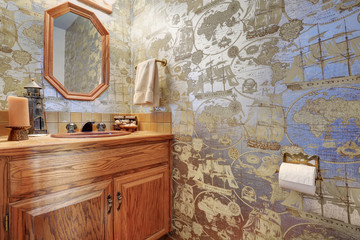 Marine style bathroom interior with view of vanity cabinet and mirror.