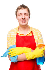 happy man ready to cleaning the house, holding a rag and spray o