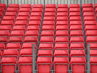 Fototapeta premium Concert Platform Closeup with Rows of Red Plastic Seats