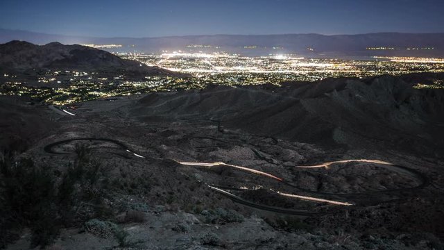 Time-Lapse of traffic along a very winding road into the mountains above Palm Springs. The lights of Palm Springs can be seen in the Distance.