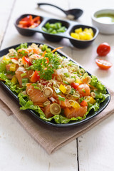 Fresh healthy thai spicy salmon salad mixed vegetable and herb
