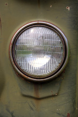 Close-up view of a headlight of an old soviet truck