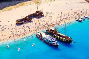 Boats anchored at Navagio beach, Zakynthos. Famous shipwreck on