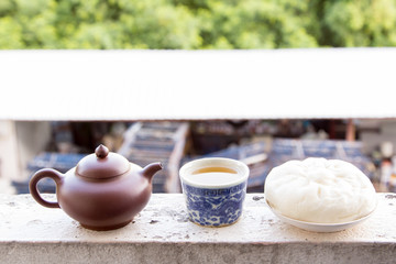 Fototapeta na wymiar Chinese teapot and Chinese tea and dumplings streamed.
