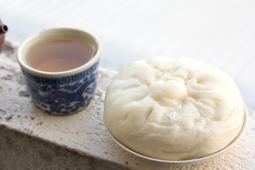 Chinese tea and dumplings streamed.