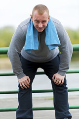 Fit man resting after jogging.