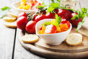 Italian sweet-sour paprika with bread and tomato
