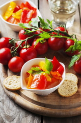 Italian sweet-sour paprika with bread and tomato