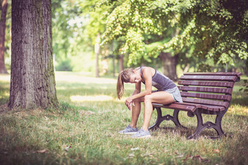 Fitness girl exercising and stretching outdoor