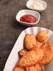 Rosemary potatoes with ketchup and mayonnaise