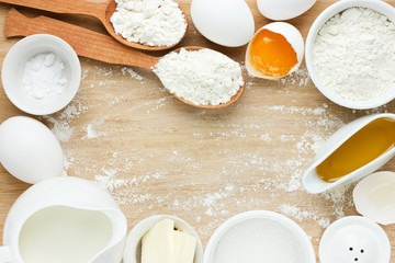 Ingredients for baking - flour, eggs, salt, sugar, butter, milk