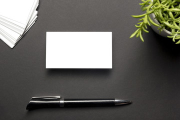 Business card blank over office table. Corporate stationery branding mock-up