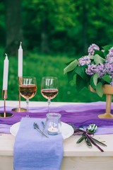 beautifully served table outdoor with flowers and decor