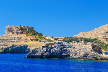 Fototapeta na wymiar rocks in the sea near the ancient city of Lindos, view from the sea