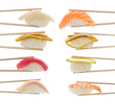 Sushi nigiri set in bamboo chopsticks isolated on white background