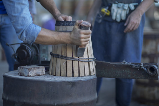 Cooperage, cooper making wine barrel